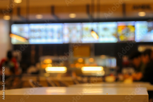 fast food restaurant cashier. blurry or defocused background.