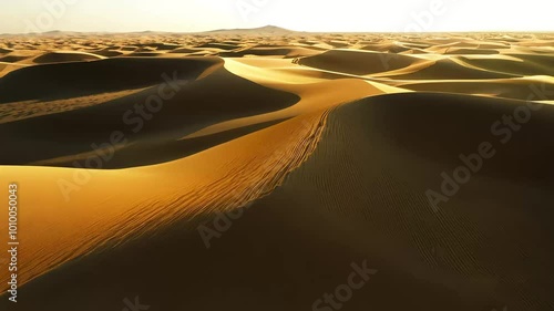 captivating topdown 4K view ofgolden sand desert painted deep shadows high dunes sunset presenting intricate wild beauty ofremote landscape abstract adventure aerial arabic background beautiful photo