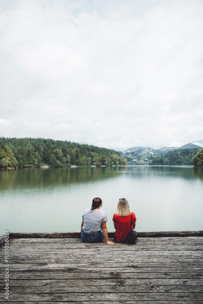 Friends enjoying a day at the lake. Best friends spending their free time by the lake. Friends enjoying a day at the lake. Best friends spending their free time by the lake.