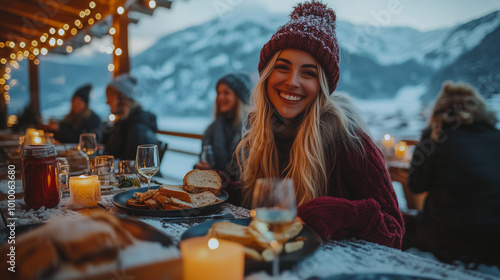Obraz na płótnie a blonde woman in a red winter outfit with a hat, having lunch at an outdoor table in the mountains, surrounded by nature and christmas lights w salonie