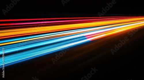 A vibrant display of light trails against a dark background, suggesting movement and energy.