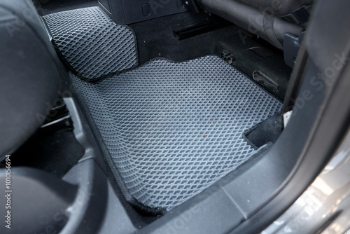 Grey rubber car floor mat in auto photo