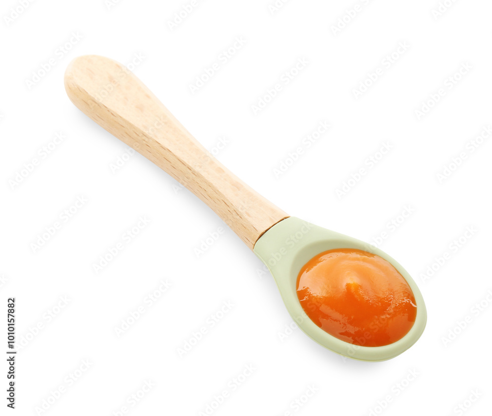 Spoon with tasty baby food isolated on white, above view Spoon with tasty baby food isolated on white, above view
