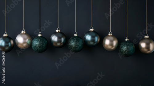 Christmas decorations background with dark green and beige color ornaments on a black wall. Space for text