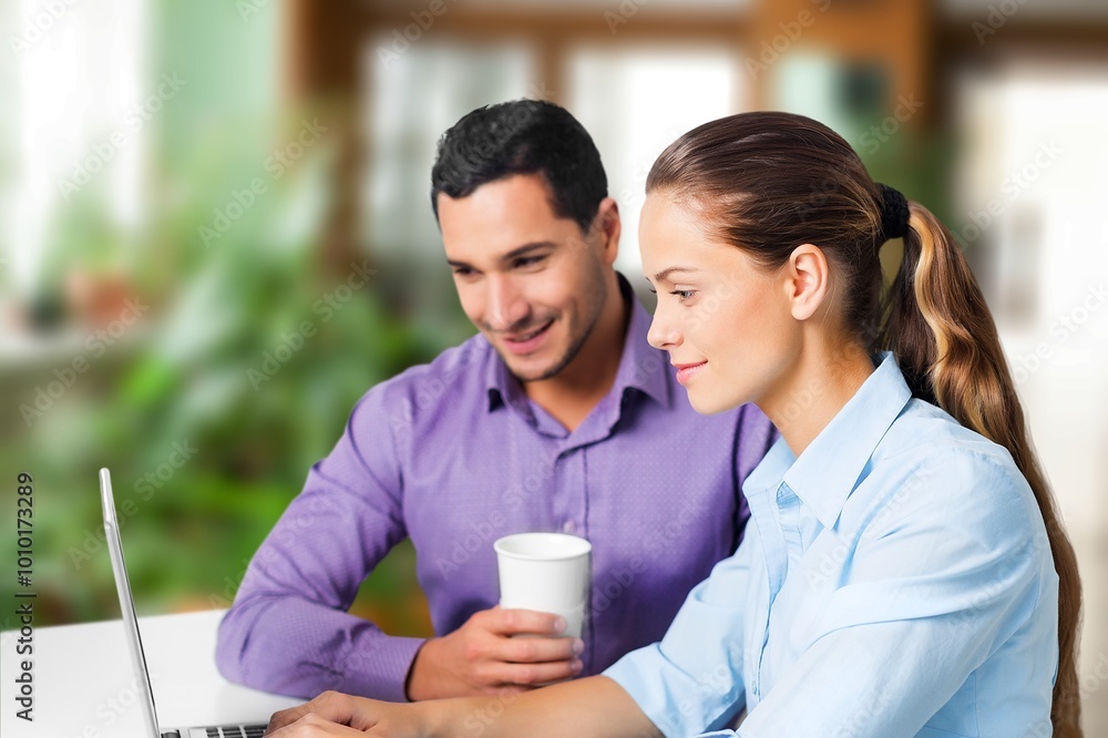 Happy professional business people collaborating in a modern office Happy professional business people collaborating in a modern office