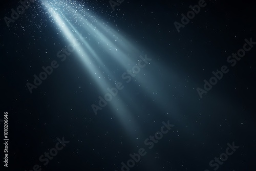 Light beam shining through the darkness of the deep ocean photo