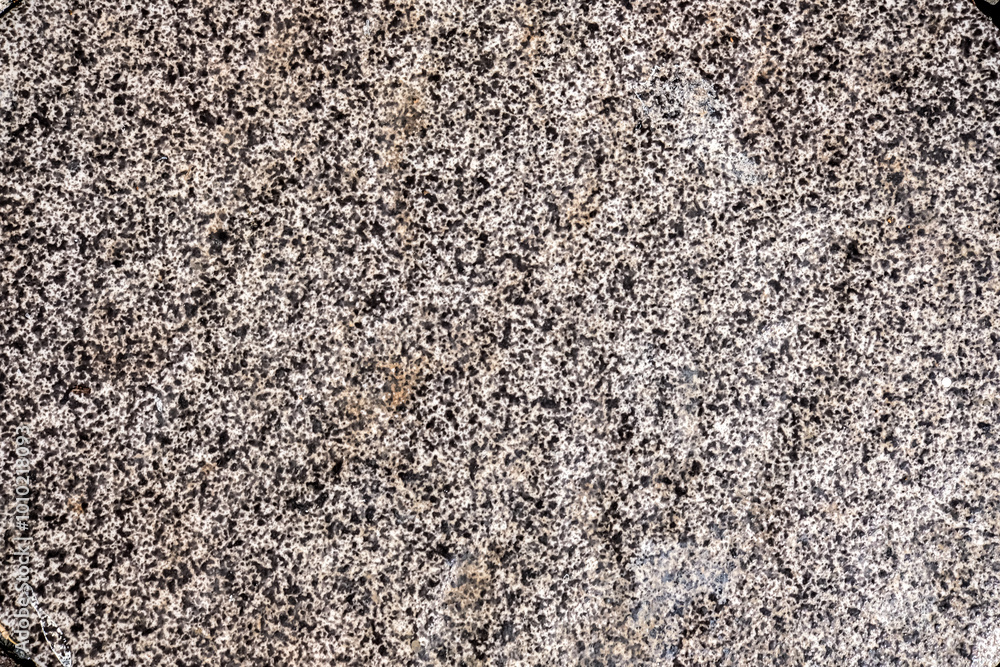 Close-up of an abstract ceramic texture with a speckled pattern of black and white, creating a unique, detailed surface ideal for background or design elements Close-up of an abstract ceramic texture with a speckled pattern of black and white, creating a unique, detailed surface ideal for background or design elements