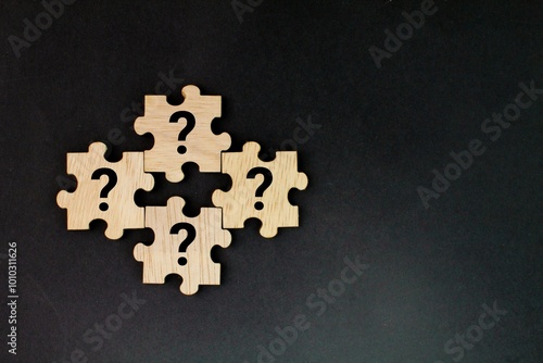 wooden puzzle with a question mark symbol. Concept of question, FAQ, Q and A, confusion and solution. question and answer concept