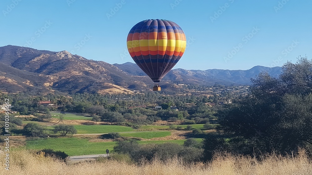 Obraz premium Hot Air Balloon Floating Above Clouds at Sunrise
