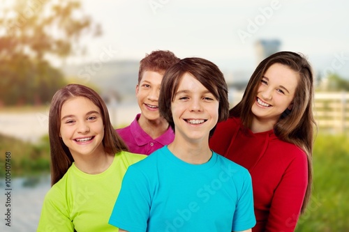 Happy kids, friends play outdoor in nature