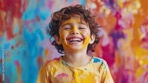 A Happy Boy with Colorful Powder on His Face Celebrating the Festival photo