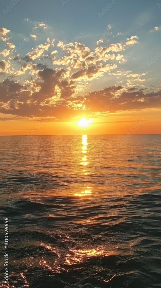Sunset over a calm sea with no visible land. Sunset over a calm sea with no visible land.