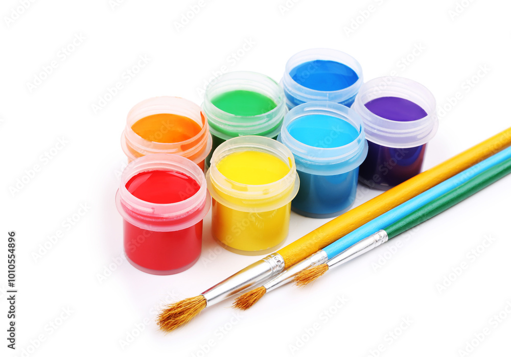 Colorful gouache paints and brushes isolated on white background Colorful gouache paints and brushes isolated on white background