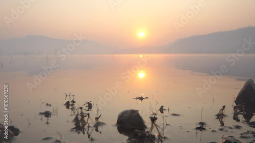 Mountains and sunrise Lam Ta Phoen Reservoir in Thailand photo