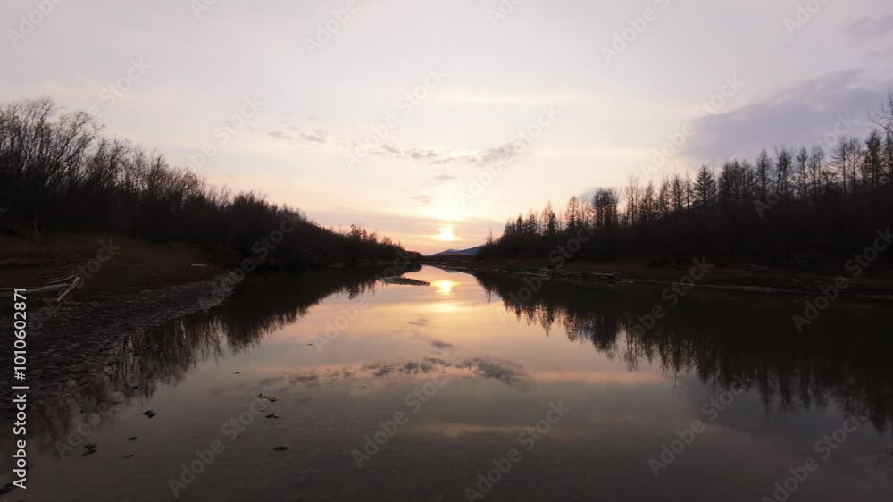 Gentle waves ripple across a tranquil river as the sun sets, casting a warm glow over the landscape. Lush trees frame the water's edge, creating a peaceful vista that invites contemplation. Gentle waves ripple across a tranquil river as the sun sets, casting a warm glow over the landscape. Lush trees frame the water's edge, creating a peaceful vista that invites contemplation.