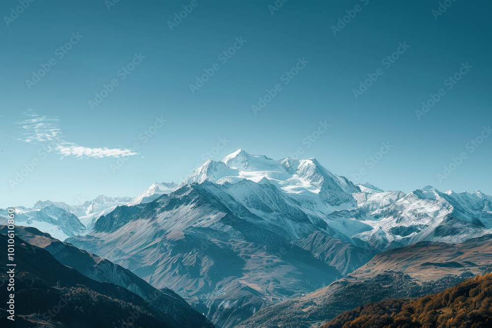 Fototapeta premium The mountains are covered in snow and the sky is clear and blue