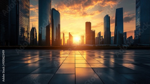 Empty city square with skyscraper silhouettes at sunset.