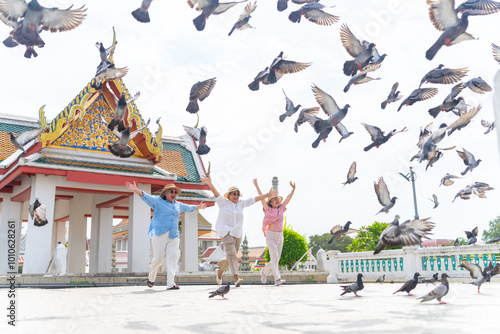 Photography Happy Asian senior woman tourist enjoy outdoor lifestyle travel Bangkok city, Thailand on summer holiday vacation