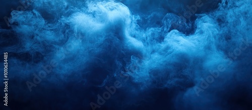 Abstract blue smoke clouds on black background.