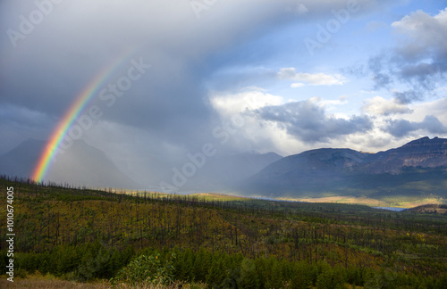 A rainbow at sunrise in Glacier National Park