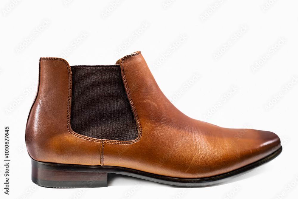 Men's brown leather chelsea boots isolated on white background. Boots made of genuine leather in classic style Men's brown leather chelsea boots isolated on white background. Boots made of genuine leather in classic style
