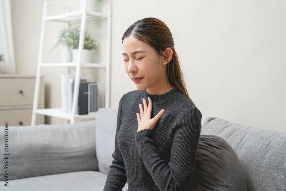 Women feeling pain in her chest from reflux acid Women feeling pain in her chest from reflux acid