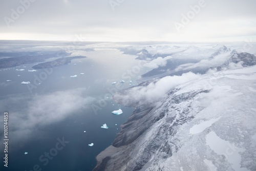 A helicopter view of the snowy mountains and fjords of Greenland in autumn. The west coast of Greenland between Ilulissat and Uummannaq.  photo