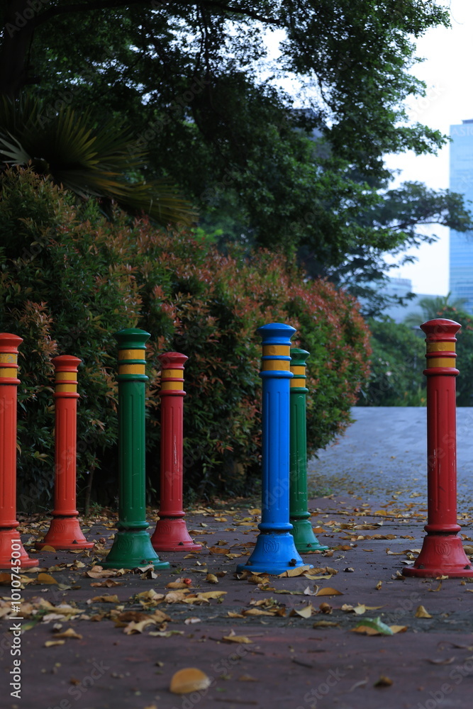 Rows of colorful iron pillars on the pedestrian walkways Rows of colorful iron pillars on the pedestrian walkways