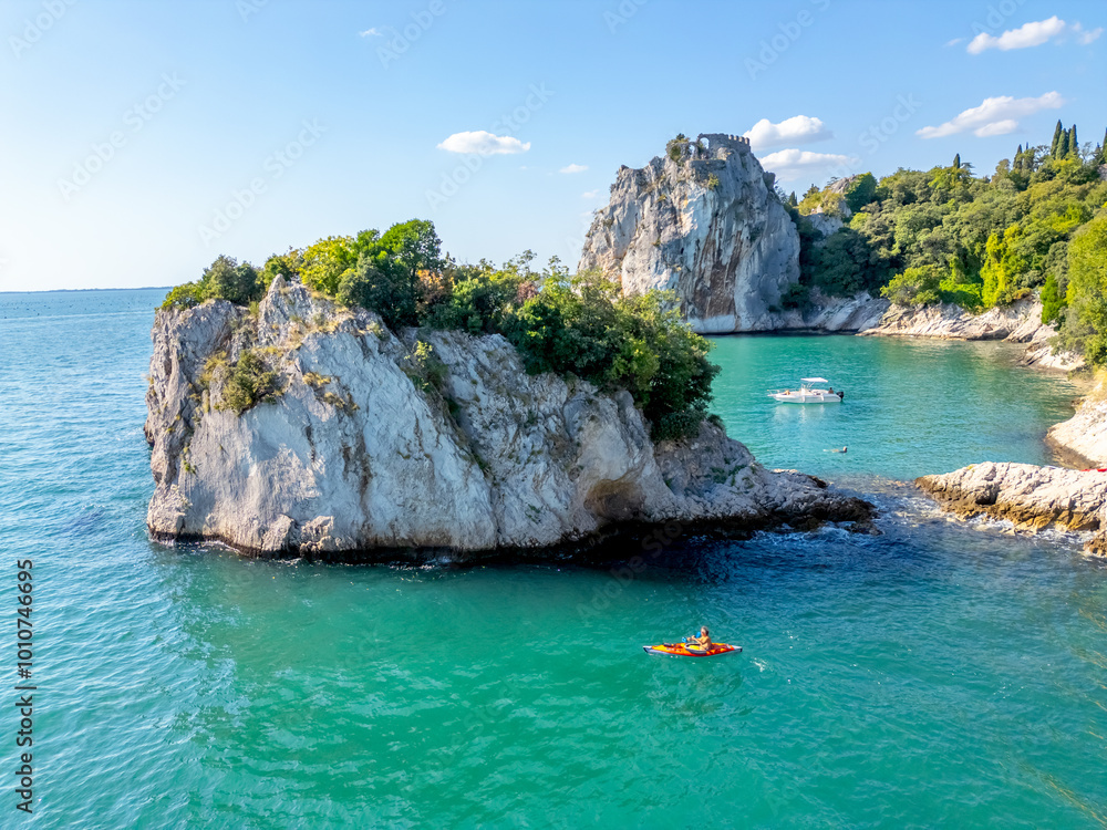 view of the Adriatic coast near Triest, Italy. Hight cliff and turquoise water of sea view of the Adriatic coast near Triest, Italy. Hight cliff and turquoise water of sea
