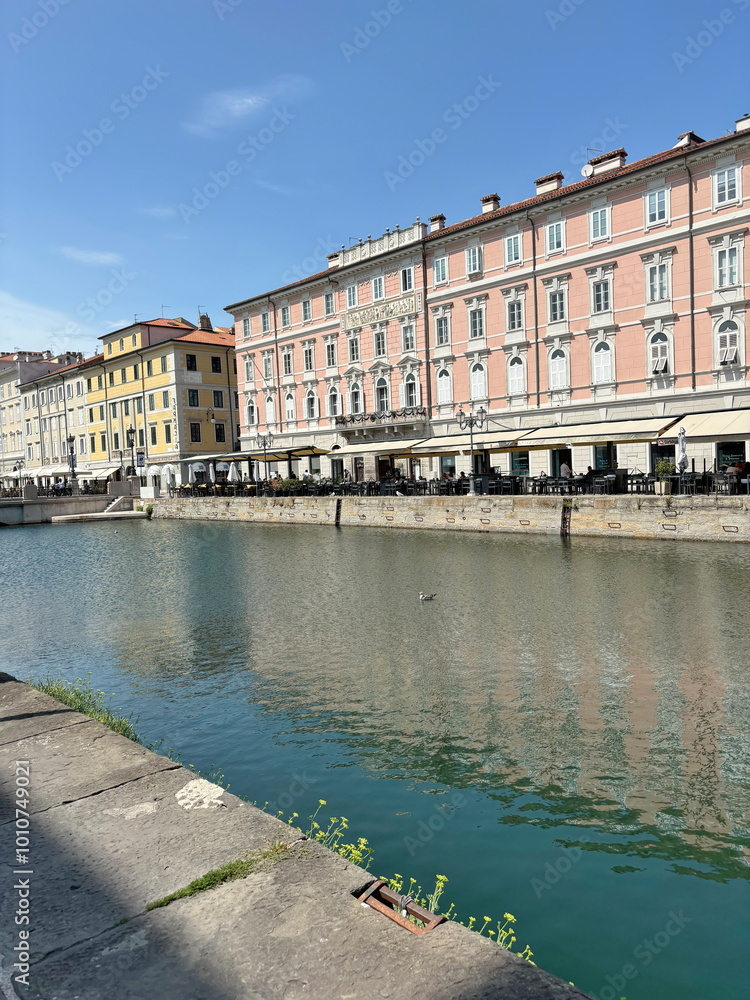The landscape of the azure surface of the water channels that separate the quarters of the city is a pleasant place for seagulls to rest.
