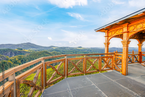 Hiking to Maria or Mariina skala wooden viewpoint built on a rock. It offers a beautiful view of the town of Jetrichovice in Bohemian Switzerland photo