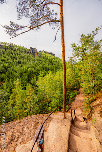 Hiking to Maria or Mariina skala wooden viewpoint built on a rock. It offers a beautiful view of the town of Jetrichovice in Bohemian Switzerland photo