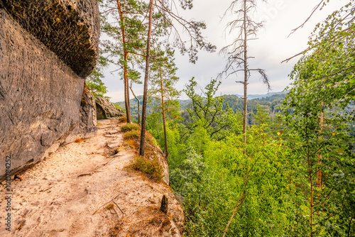 Hiking to Maria or Mariina skala wooden viewpoint built on a rock. It offers a beautiful view of the town of Jetrichovice in Bohemian Switzerland photo