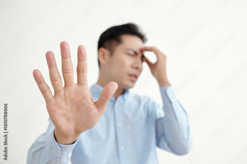 Tired man showing stop sign on white background Tired man showing stop sign on white background