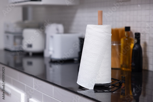 Rolling tissue paper on the kitchen counter photo