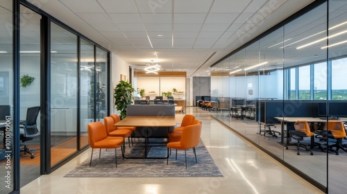 Modern office space with collaborative workstations, casual seating areas, and glass walls