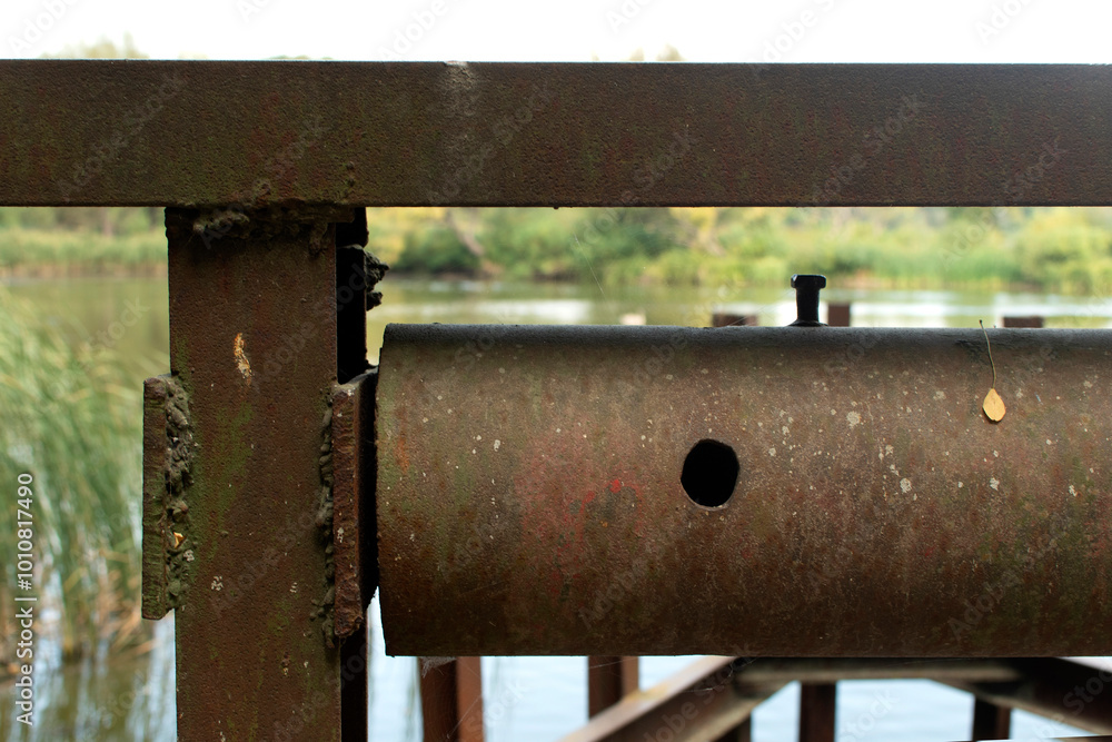 A rusted part of the lifting mechanism of an old dam A rusted part of the lifting mechanism of an old dam