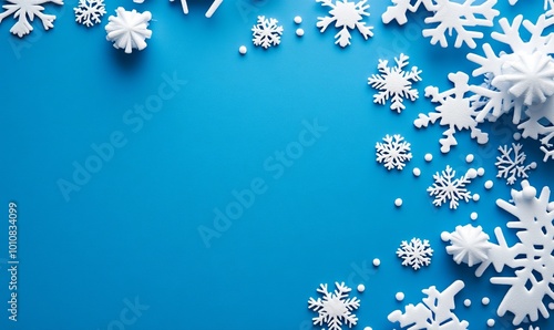 A blue background with snowflakes scattered around it photo