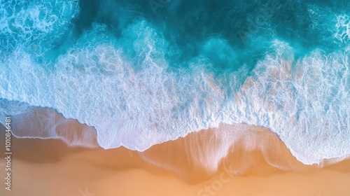 Aerial view of turquoise ocean waves gently crashing onto a sandy Vietnam beach, creating a beautiful natural background for summer vacation.