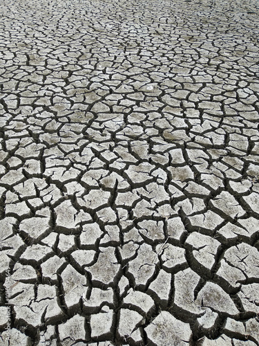 Cracked earth. Dry lake..Climate change or drought concept.Global warming concept. photo