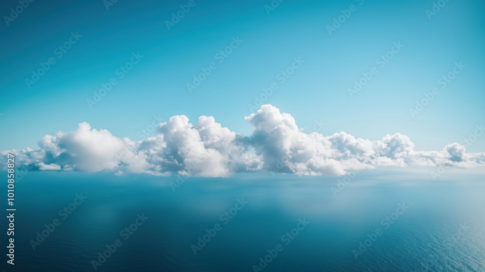 Obraz premium Serene Seascape White Clouds Reflecting on Calm Blue Ocean