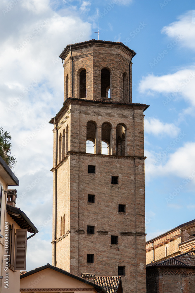 Franciscan church bell tower rises above the urban skyline of Parma, Italy, creating a historic landmark Franciscan church bell tower rises above the urban skyline of Parma, Italy, creating a historic landmark