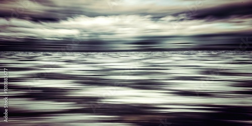 Blurred motion of gray and white streaks.