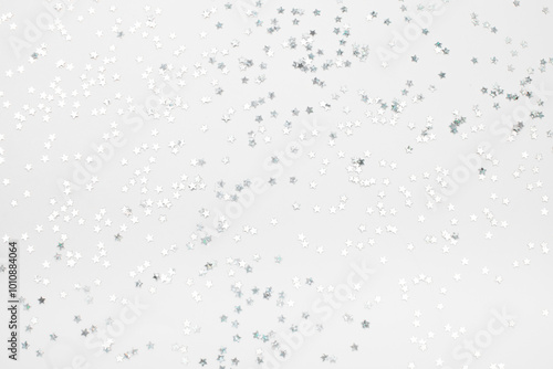 sparkles silver stars on white background with text place- Image