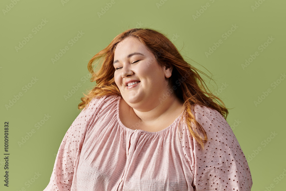 Fototapeta premium A woman with long red hair smiles brightly.