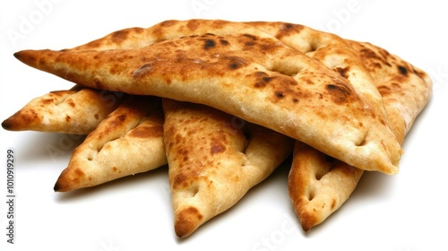 A stack of pita bread rounds, arranged on a white background to focus on their simple design and soft, doughy texture.