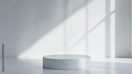 A minimalist white platform in a well-lit, empty room with soft shadows.