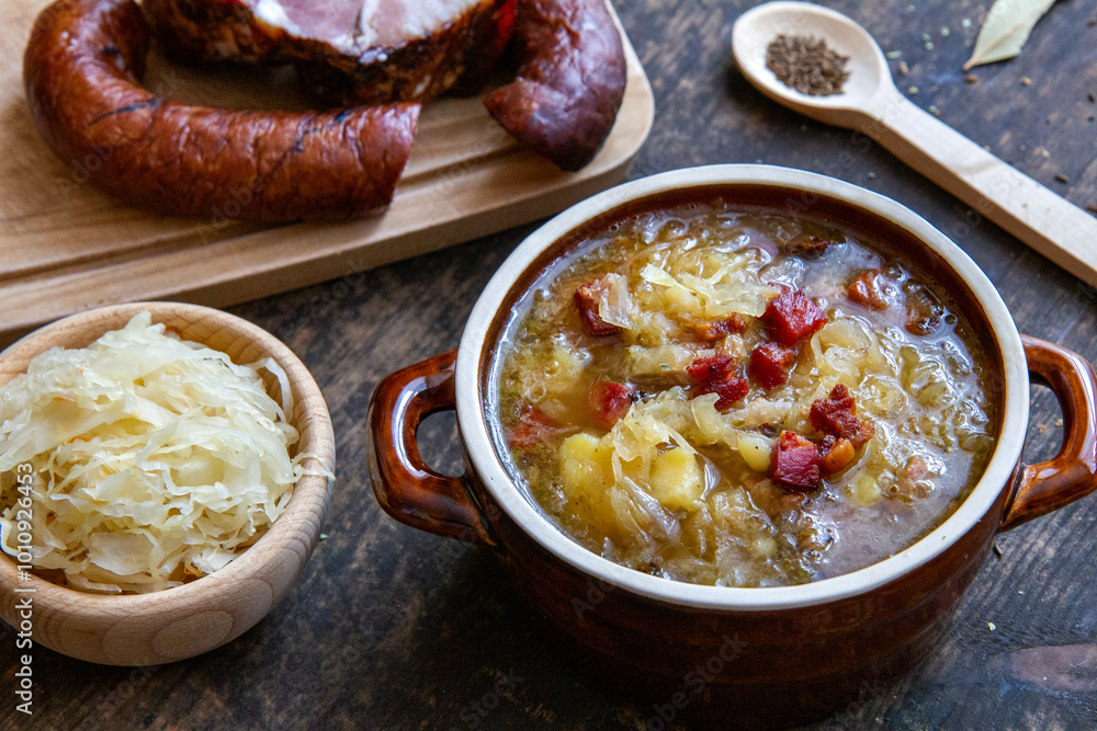 Φωτογραφία Kapuśniak - homemade, traditional Polish soup made of sauerkraut with potatoes,