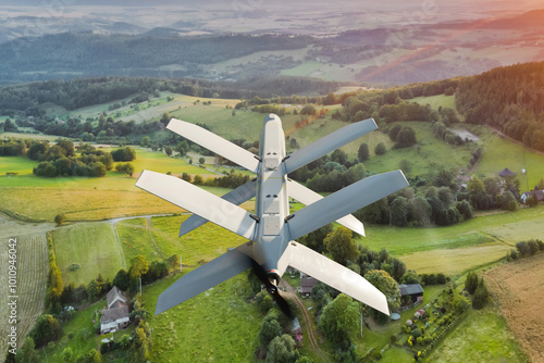 Obraz na płótnie Military drone with folding wings flying in the air. UAV combat mission - 3d rendering w salonie