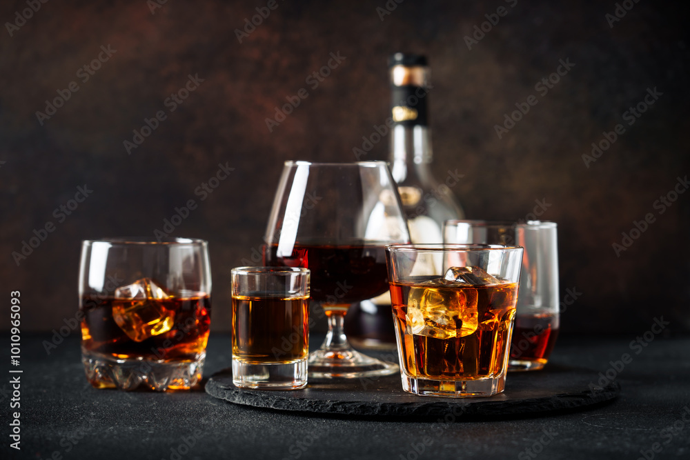 Strong alcohol drink. Whisky, rum, tequila, cognac at dark bar. Strong alcohol drink. Whisky, rum, tequila, cognac at dark bar.